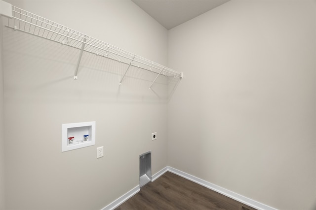 washroom featuring electric dryer hookup, dark hardwood / wood-style floors, and hookup for a washing machine