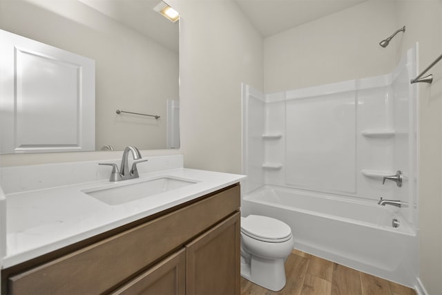 full bathroom featuring vanity, shower / bathing tub combination, wood-type flooring, and toilet