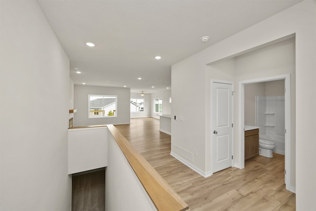 hallway with light wood-type flooring