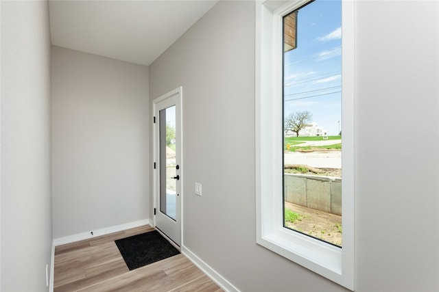 doorway to outside with light hardwood / wood-style flooring