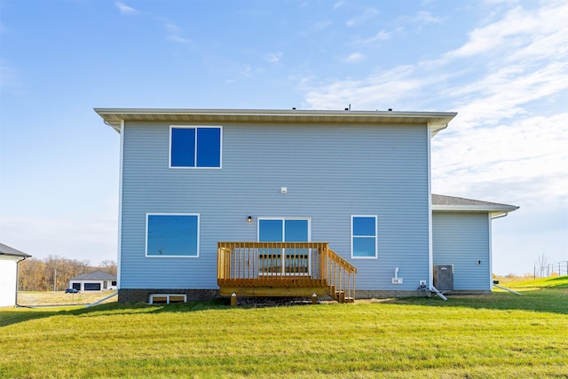 back of property featuring a yard and a deck