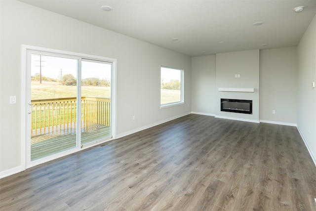 unfurnished living room with hardwood / wood-style flooring