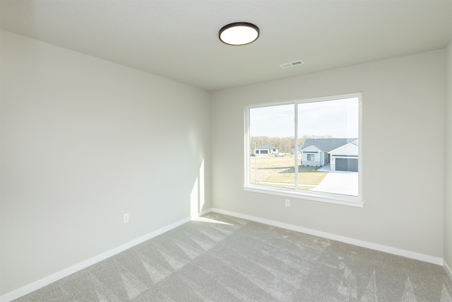 unfurnished room featuring carpet flooring