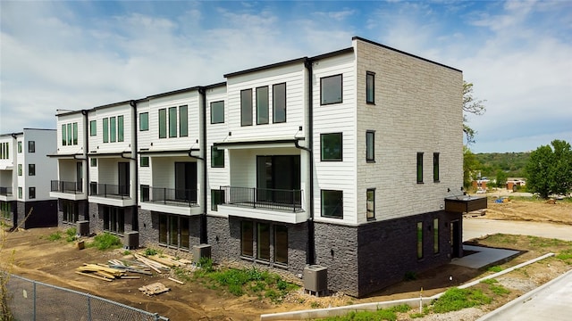 view of building exterior with central AC unit