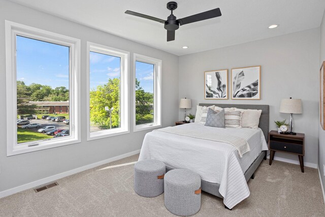 2726 Fleur Dr Unit 17, Des Moines, IA 50321 - carpeted bedroom with baseboards, ceiling fan, and recessed lighting