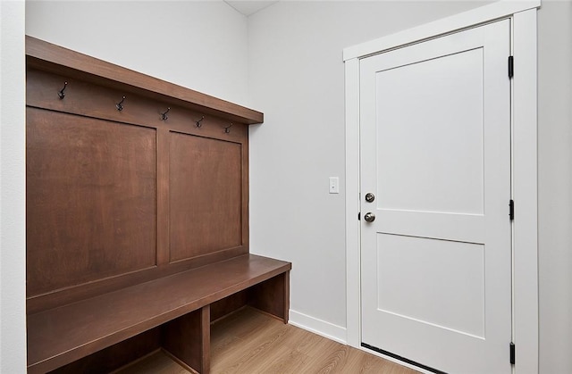 mudroom featuring light wood-type flooring and baseboards