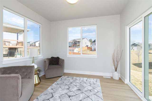 sitting room with light hardwood / wood-style floors