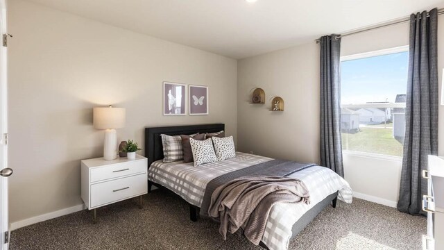 carpeted bedroom featuring multiple windows