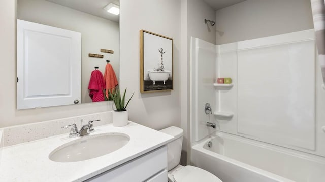 bathroom with toilet, tub / shower combination, and vanity