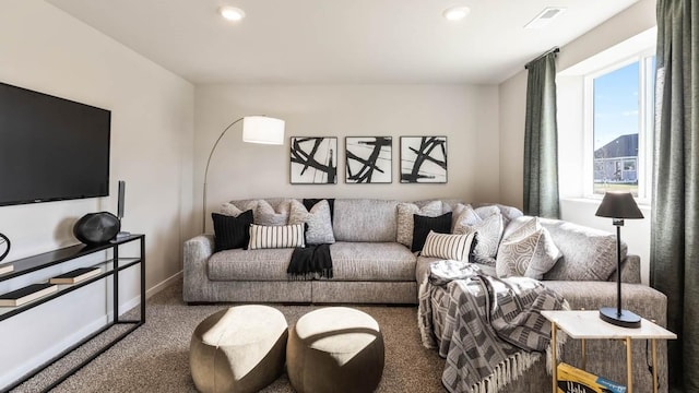 carpeted living area with baseboards, visible vents, and recessed lighting