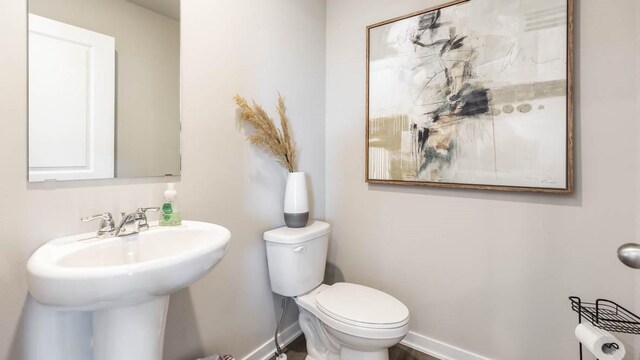 bathroom with sink and toilet