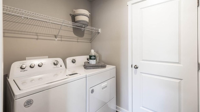 clothes washing area with laundry area and separate washer and dryer