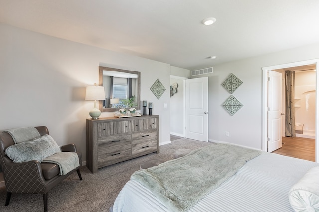 bedroom featuring carpet and ensuite bath