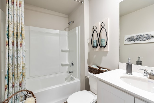 full bathroom with shower / bath combination with curtain, vanity, and toilet