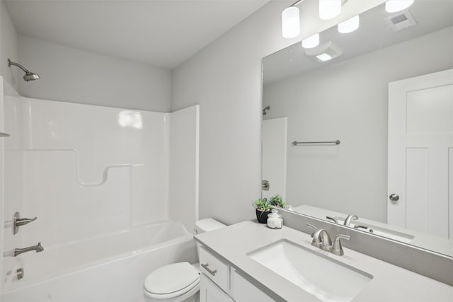 bathroom featuring toilet, washtub / shower combination, visible vents, and vanity