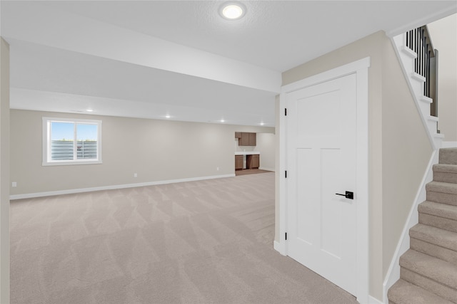 basement with light carpet