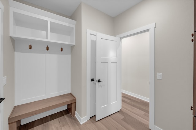 mudroom with light hardwood / wood-style flooring