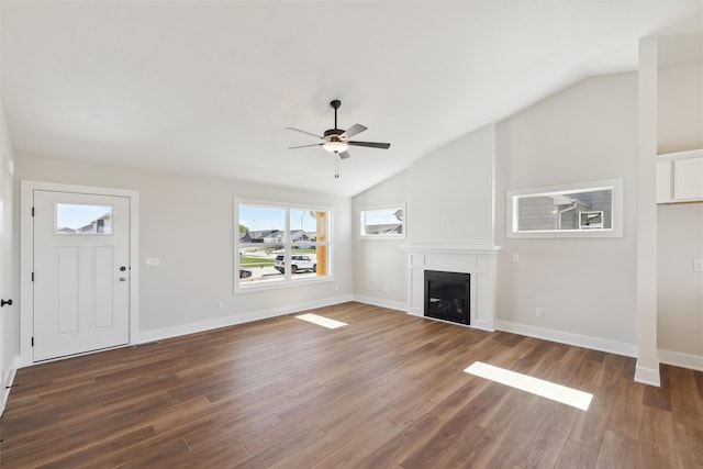 unfurnished living room featuring lofted ceiling, ceiling fan, and dark hardwood / wood-style flooring