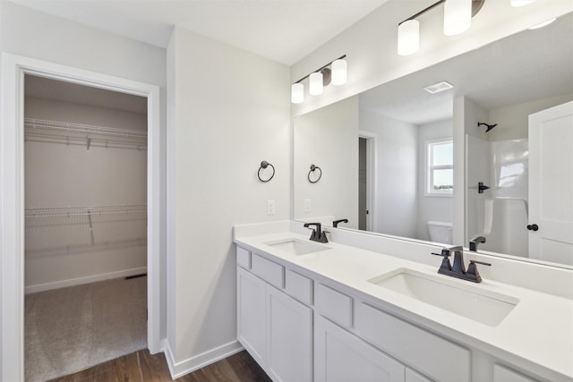 1204 Deer Ridge Dr NW, Bondurant, IA 50035 - full bath with wood finished floors, a sink, a shower, and toilet