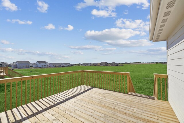 wooden deck with a yard