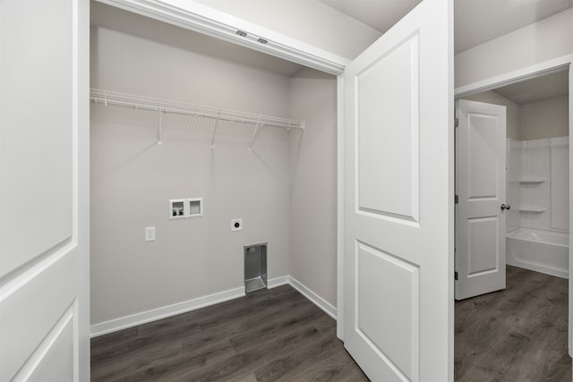 clothes washing area featuring dark wood-type flooring, hookup for a washing machine, and electric dryer hookup