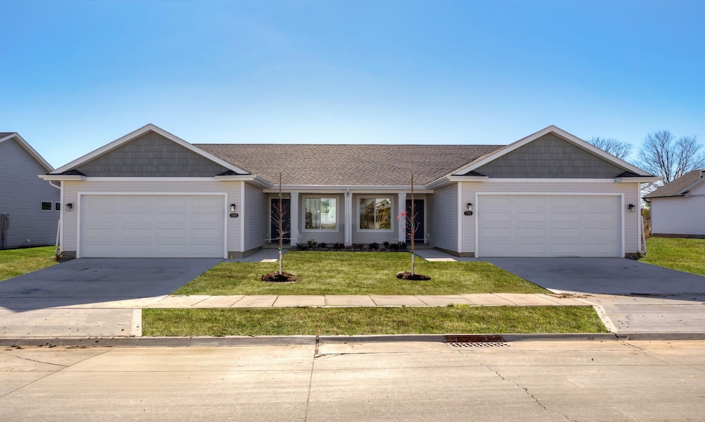 770 Linden St, Carlisle, IA 50047 - ranch-style house featuring an attached garage, concrete driveway, a front lawn, and roof with shingles