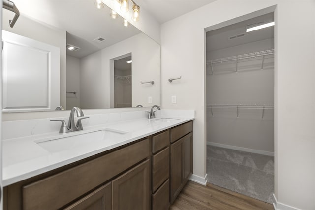 bathroom with vanity and hardwood / wood-style floors