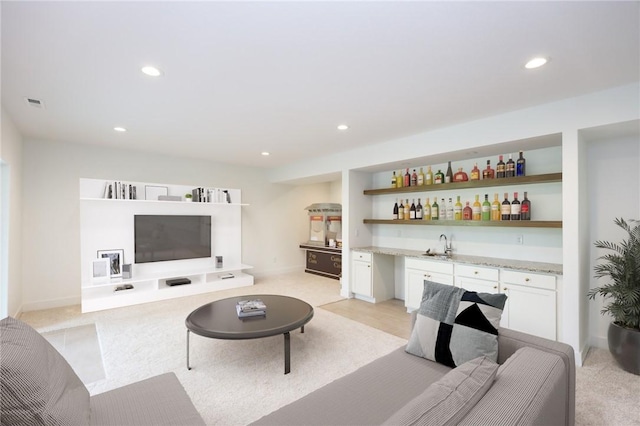 1773 Highland Cir SW, Altoona, IA 50009 - living area featuring wet bar, recessed lighting, light carpet, and baseboards