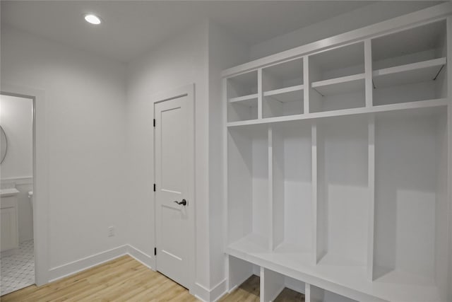 1773 Highland Cir SW, Altoona, IA 50009 - mudroom with light wood-style floors, baseboards, and recessed lighting