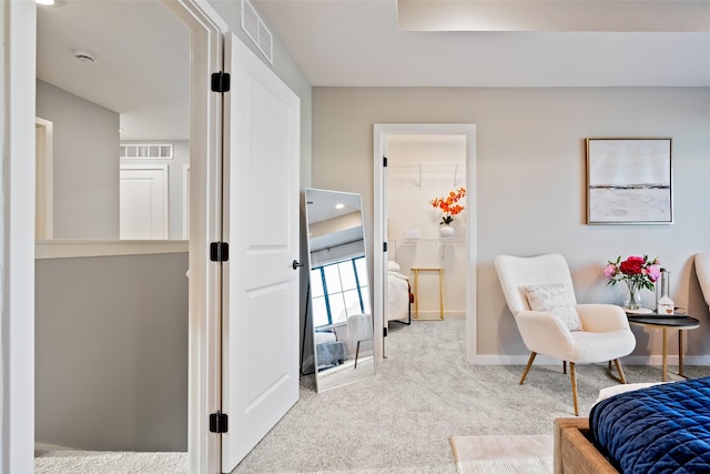 sitting room featuring carpet floors