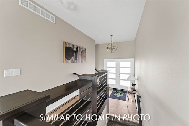 interior space featuring hardwood / wood-style floors and french doors