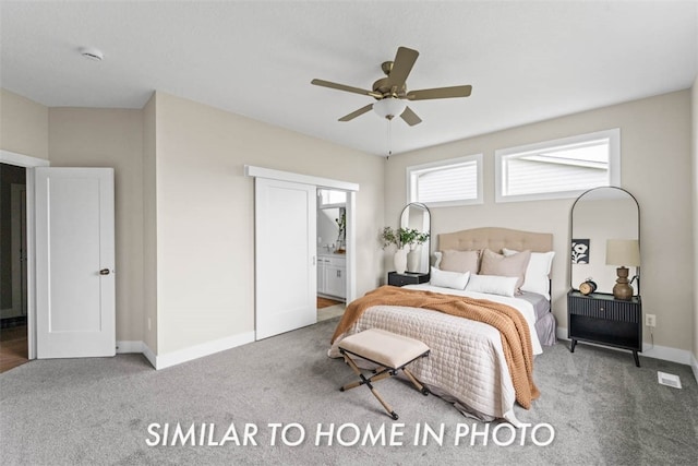 bedroom with ensuite bath, ceiling fan, and carpet floors