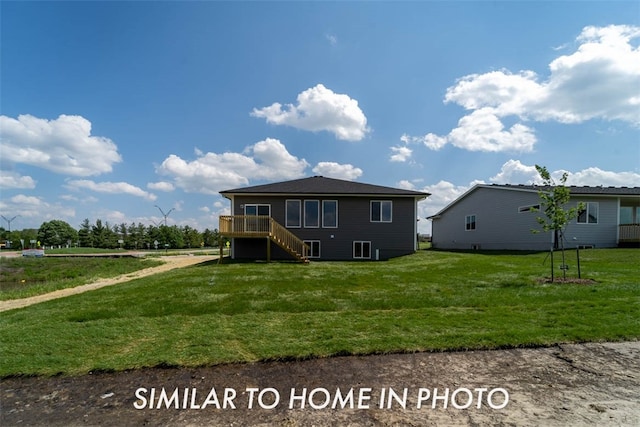 rear view of house featuring a lawn and a deck