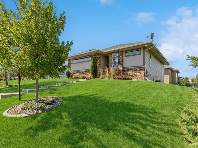 view of front of house featuring stone siding and a front lawn