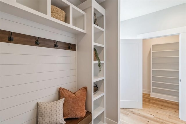 mudroom with wood finished floors