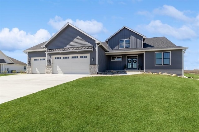 craftsman-style house with driveway, board and batten siding, an attached garage, a front lawn, and a standing seam roof