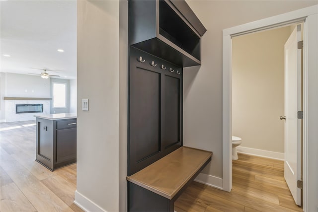 mudroom with light hardwood / wood-style flooring and ceiling fan