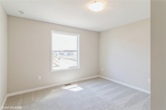 unfurnished room featuring carpet flooring