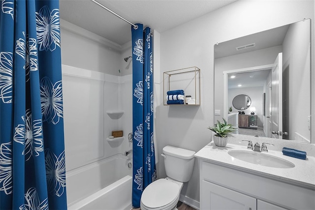 full bath featuring shower / bath combo, visible vents, vanity, and toilet