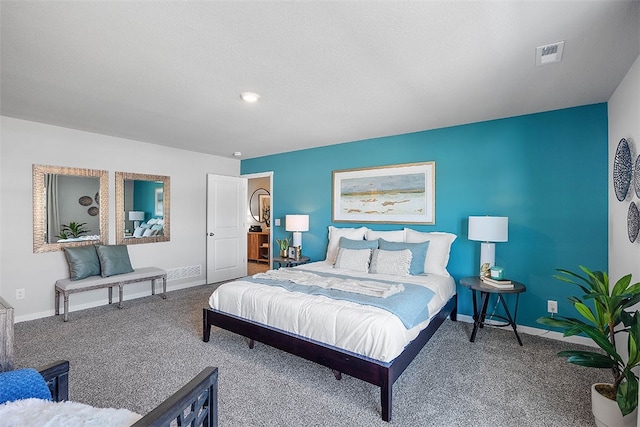 bedroom with carpet, visible vents, and baseboards