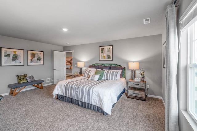 bedroom with visible vents, baseboards, and carpet flooring