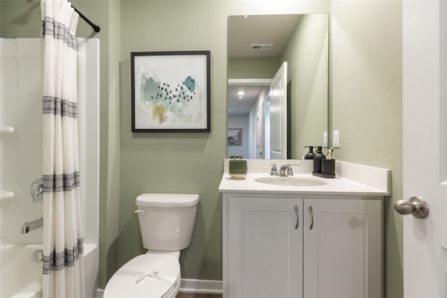 full bathroom with visible vents, shower / tub combo, vanity, and toilet