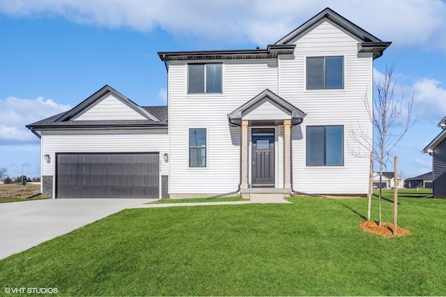 view of front of property with a garage and a front yard