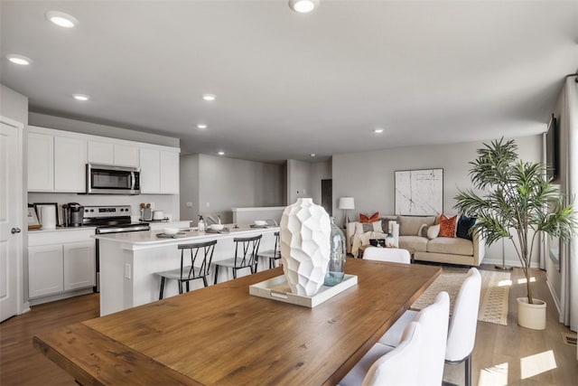 dining space featuring hardwood / wood-style floors