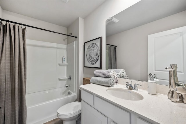 full bathroom with toilet, shower / tub combo with curtain, and vanity