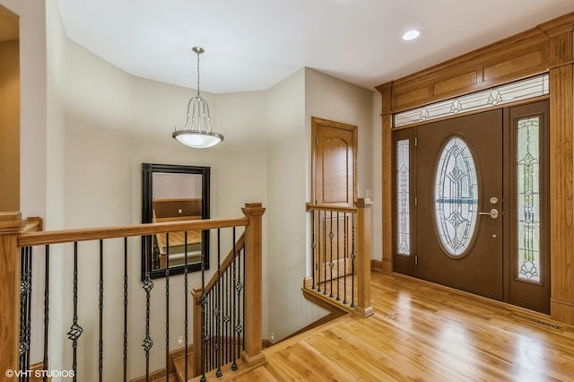 entryway with light hardwood / wood-style flooring