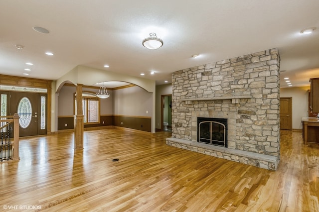 unfurnished living room with light hardwood / wood-style floors and a fireplace