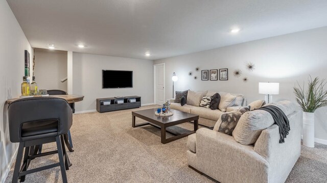 living room featuring light carpet