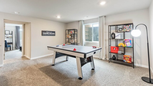 game room featuring light colored carpet