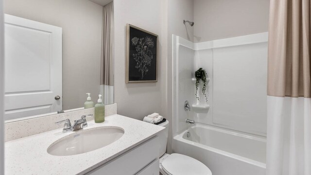 full bathroom featuring shower / bathtub combination with curtain, vanity, and toilet